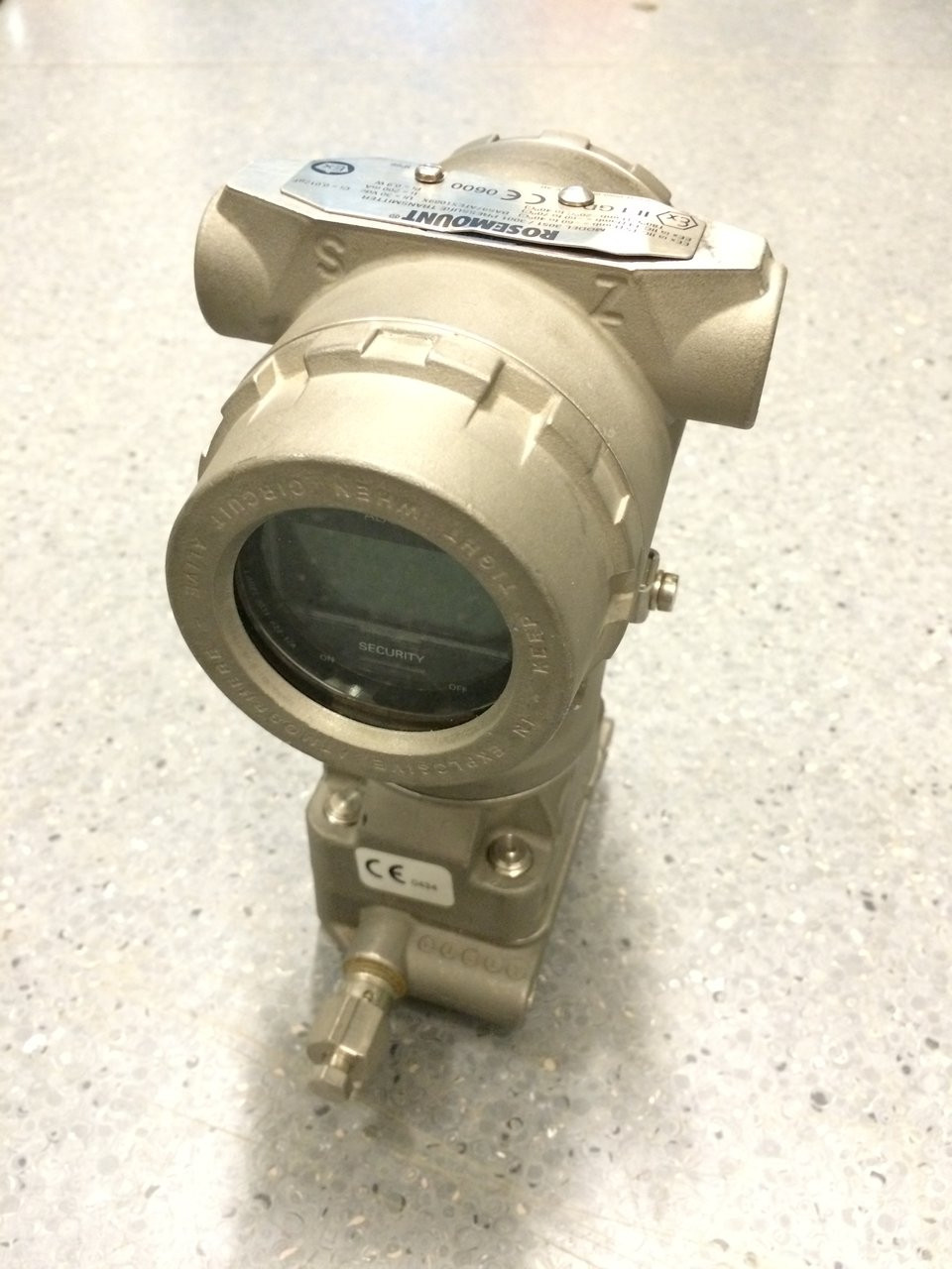 Industrial pressure transmitter with an LCD display.