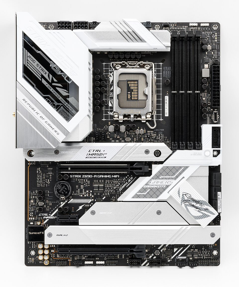 A modern computer motherboard with processor socket, memory slots and expansion connectors.