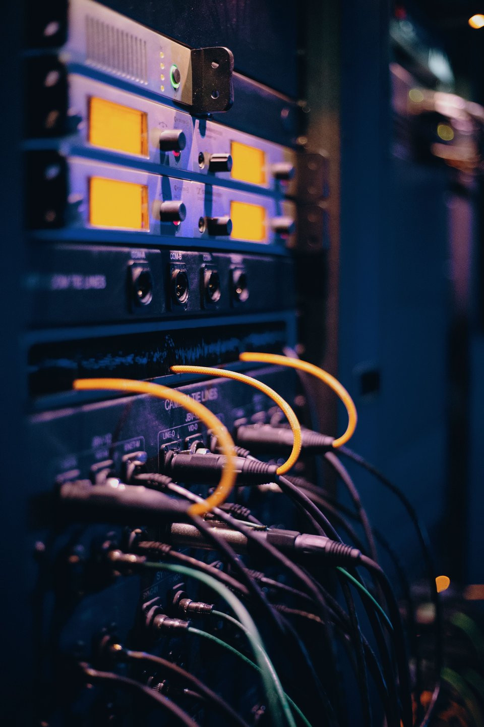 Broadcast signal equipment and patch cables in an electronics rack.