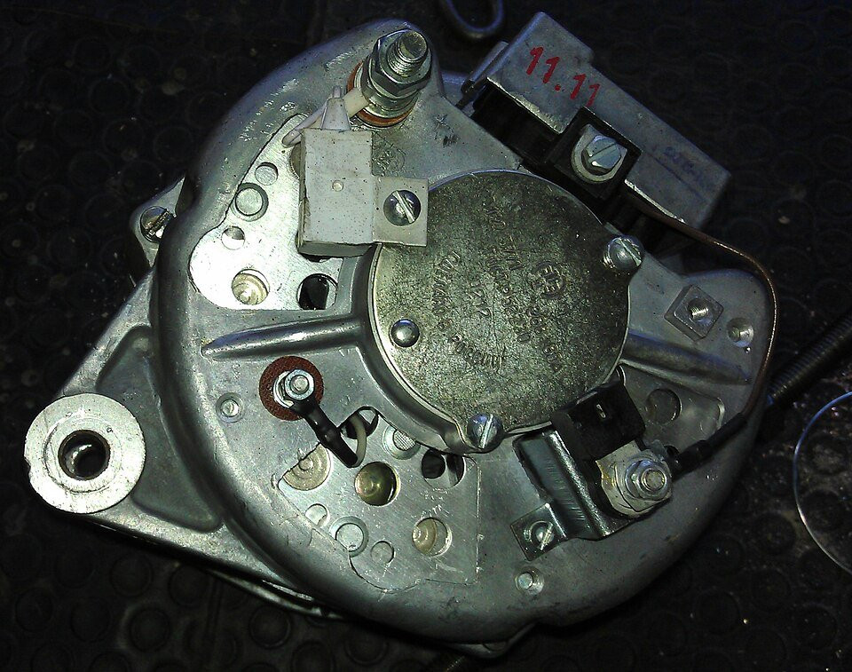 The terminals and rear housing of an automotive alternator.