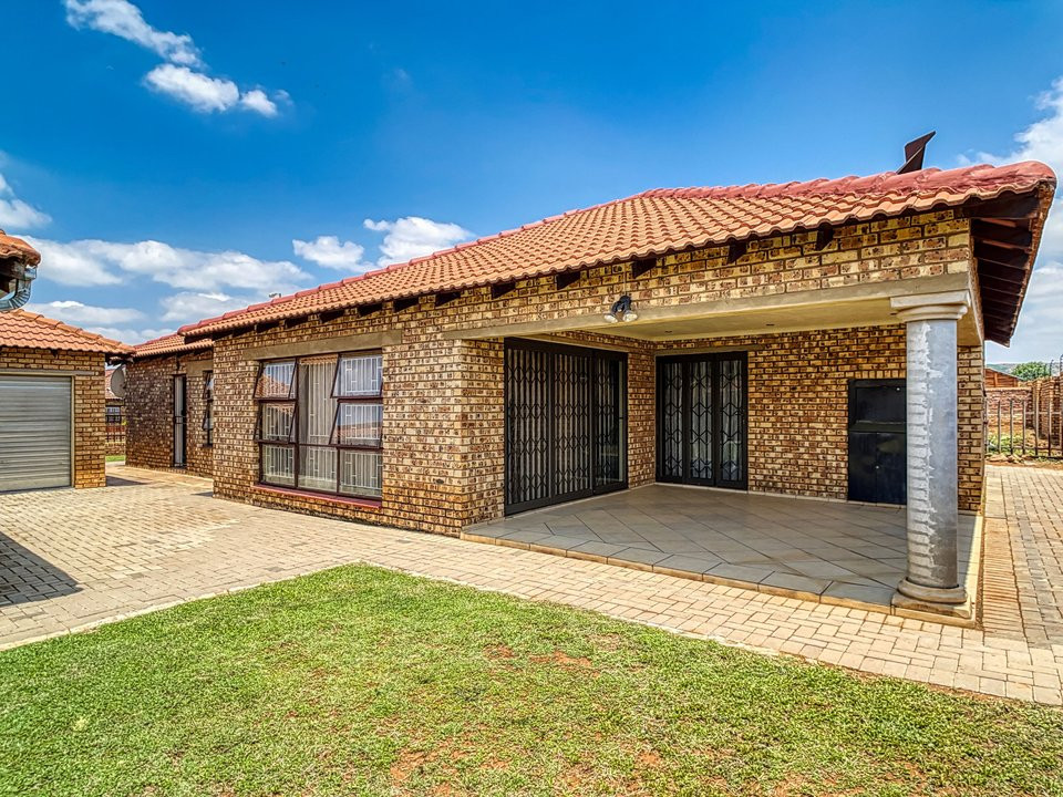Brick residential house, patio and lawn in Pretoria, South Africa.