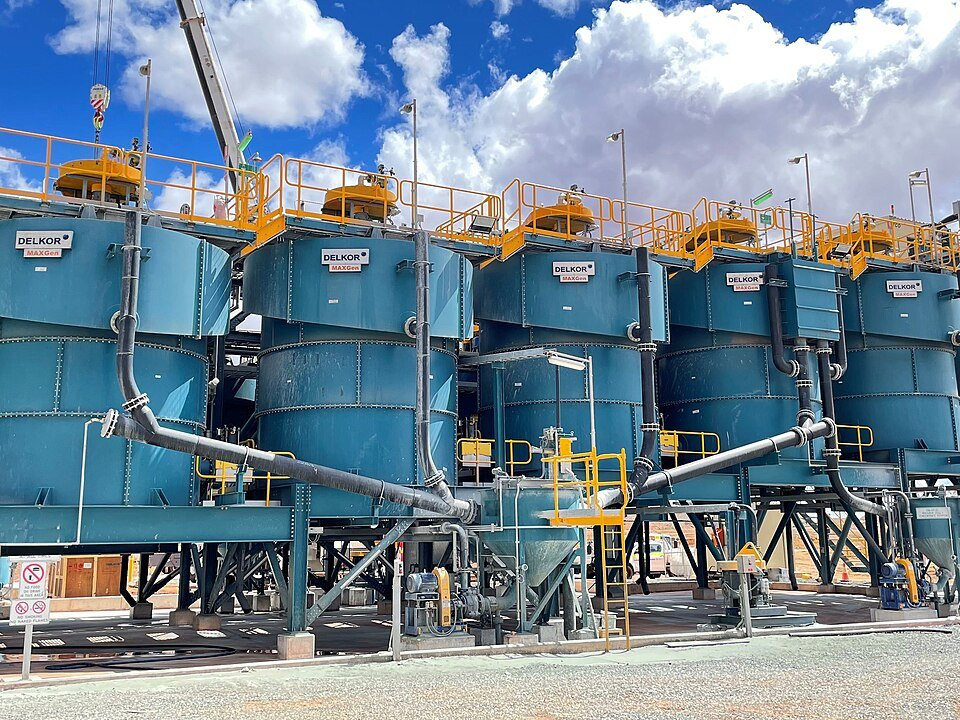 Industrial flotation cells with process piping and access platforms.